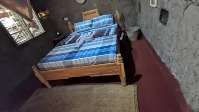 an overhead view of a bed in a room at Alkebulan Farm House in Moshi