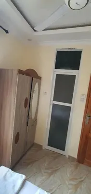 a room with a door and a window in it at Hopeland Villas in Msaranga