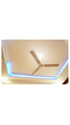 a ceiling light in a room with a ceiling fan at Hopeland Villas in Msaranga