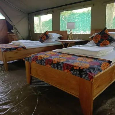 a bedroom with two beds in a tent at MCF LUXURY Tents in Moshi