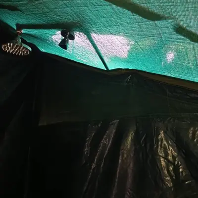 a close up of a bed in a tent at MCF LUXURY Tents in Moshi