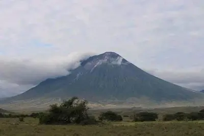 a mountain in the middle of a field at Eagle Nest lake Natron Lodge in Mtowabaga
