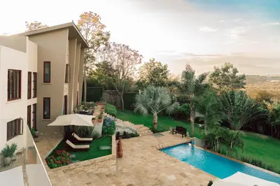 an image of a house with a swimming pool at The Scenery Residence in Arusha