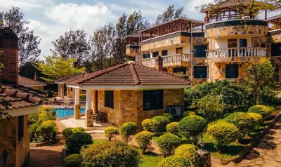 a large house with a yard with a swimming pool at Gafa House lodge in Sokon