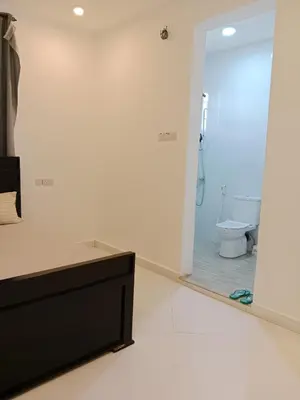 a bathroom with a shower and a toilet in it at Hidalgo Explorers Home in Moshi