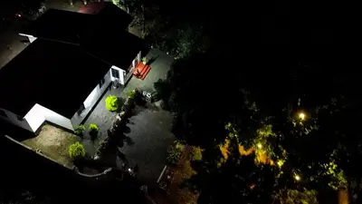 an overhead view of a house with a red truck at Eheruro Homestay in Arusha