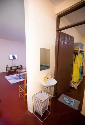 a bathroom with a sink and a mirror at Bantulaki House in Arusha