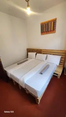 a bedroom with two large beds in a room at Mardai Homestay in Arusha