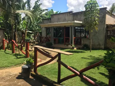 a house with a wooden fence in front of it at Humphrey home stay in Arusha