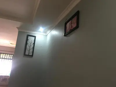 a room with two pictures on the wall at Humphrey home stay in Arusha