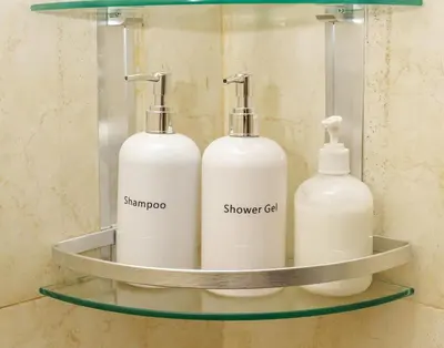 a bathroom shelf with two soap bottles on it at Arusha Urban Haven Homes - Amani Apartment in Arusha
