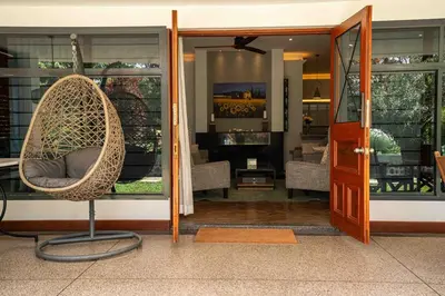 a wicker chair sitting in front of a store at The Green House in Arusha