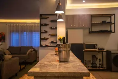 a kitchen counter with a blender on top of it at The Green House in Arusha