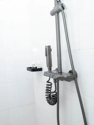 a phone on a stand in a bathroom at damanda homes in Moshi
