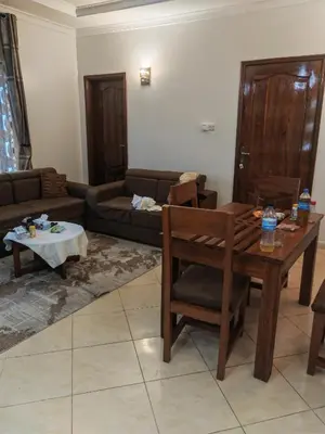a living room with a couch and a table at \u86cb\u7092\u996d\u6c11\u5bbf in Samanga