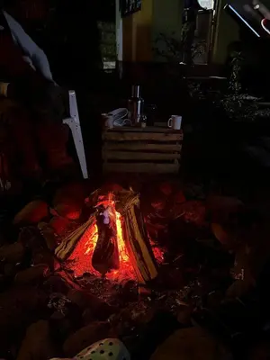 a fire in the middle of a room at Mai Kilimanjaro Home Stay in Moshi