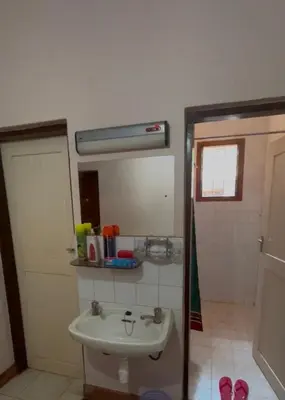 a bathroom with a sink and a mirror at Kitonga Escape in Msaranga