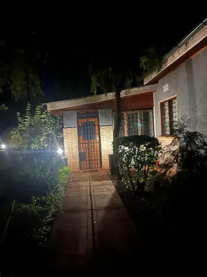 a house with a door at night at Kitonga Escape in Msaranga