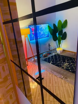 a room with a cross on the floor and a tv at gustavo in Sokon