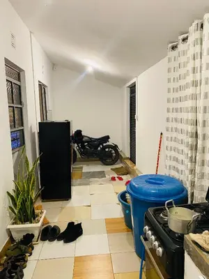 a living room with a motorcycle parked in a room at gustavo in Sokon