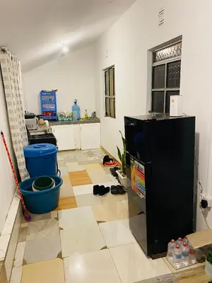 a living room with a kitchen with a floor at gustavo in Sokon
