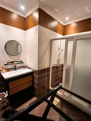 a bathroom with a sink and a shower at Meru Havens in Arusha
