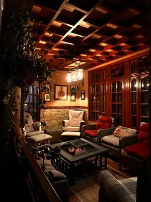 a living room with couches and a table in a room at Meru Havens in Arusha