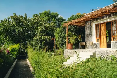 a small house with a pathway leading to it at Mateves boutique lodge in Arusha