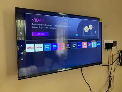 a flat screen tv hanging on a wall at Kili Spring Hotel in Arusha