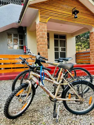 two bikes parked in front of a house at The Dawn cottage in Moshi