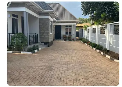 a house with a brick driveway in front of it at Samirehousea in Msaranga