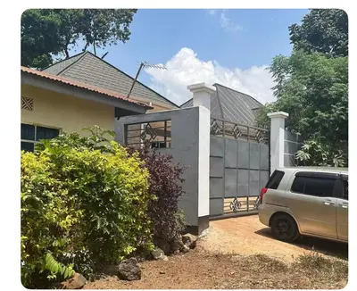a van parked in front of a house at Samirehousea in Msaranga