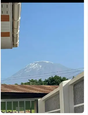 a view of a snow covered mountain from a house at Samirehousea in Msaranga