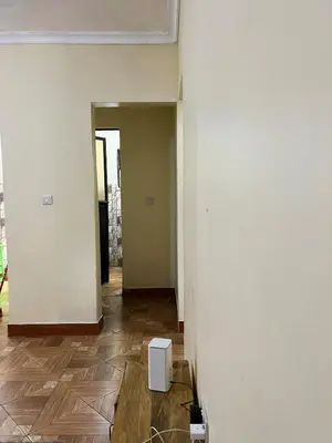 an empty room with a white wall and a floor at 'La Maison' 2 bedroom house in Arusha in Arusha