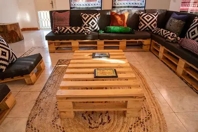 a living room with a couch and a coffee table at Kwetu Hostel in Arusha