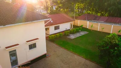 an aerial view of a house with a yard at Kwetu Hostel in Arusha