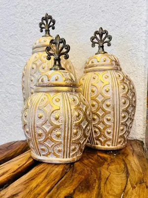 two vases sitting on top of a wooden table at City Retreat Studio X in Arusha