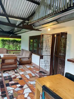 a living room with a couch and a table at Jibambe campsite in Moshi