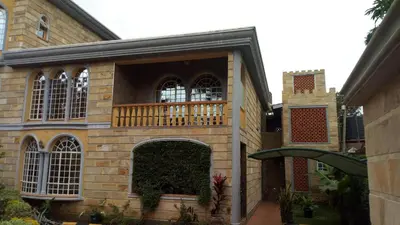 an external view of a building with a balcony at Madalina's Appartment in Arusha