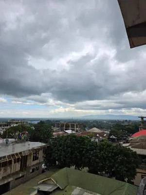 a view of a city under a cloudy sky at Twiga Hotel - Tulivu Urban in Moshi