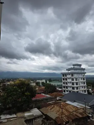 a view of a city under a cloudy sky at Twiga Hotel - Tulivu Urban in Moshi
