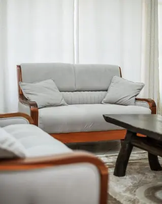 a living room with a couch and a table at D&G Homes Apartments in Arusha