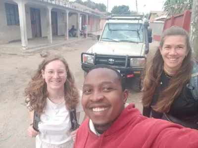 a man and two girls posing for a picture at Msovi House in Arusha