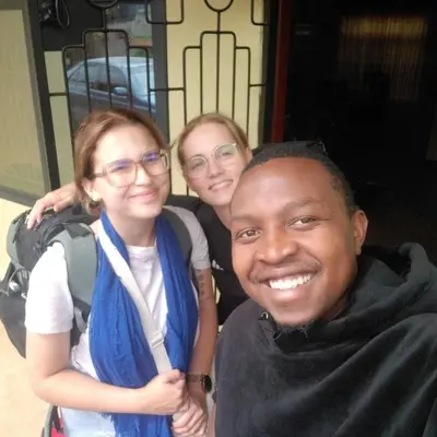a man and two girls posing for a picture at Msovi House in Arusha