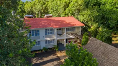 an aerial view of a house with a red roof at Summit Retreat in Moshi