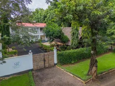 an aerial view of a house with a fence and a yard at Summit Retreat in Moshi