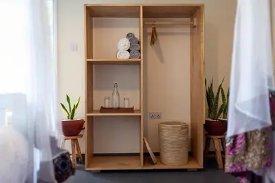 a book shelf with items on it in a room at Summit Retreat in Moshi