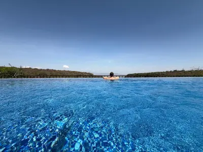 a person in a boat in a large body of water at Africa Safari Manyara Escarpment in Mto wa Mbu