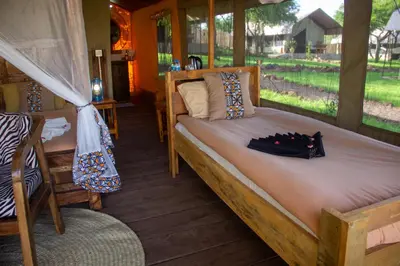 a large bed in a room with a window at Africa Safari Manyara Escarpment in Mto wa Mbu