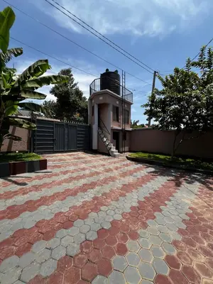 a brick driveway in front of a house at Hadraj Moshono Apartment2 in Arusha